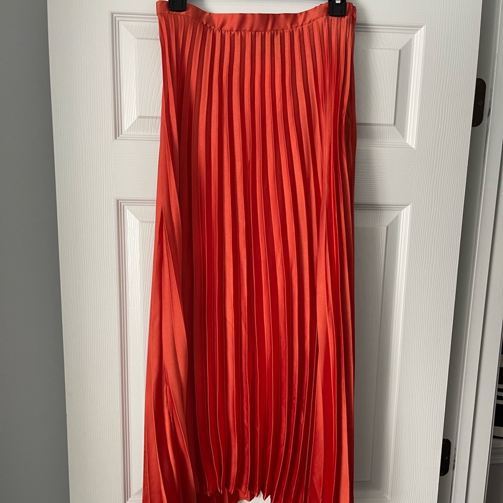 Pleated orange skirt
